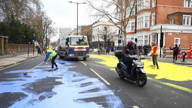 Protest group &#39;Led by Donkeys&#39; spread paint in the colours of the Ukrainian flag on a road, ahead of the first anniversary of Russia&#39;s invasion of Ukraine, outside the Russian Embassy in London, Britain February 23, 2023. REUTERS/Hannah McKay
