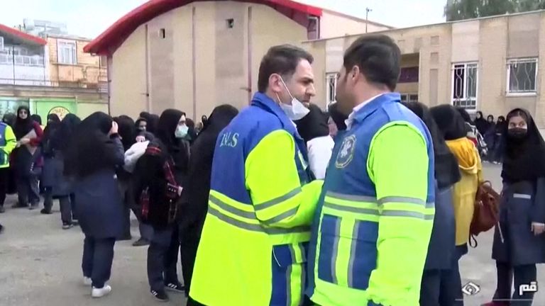 Authorities at the scene of a school in Iran Pic: AP 