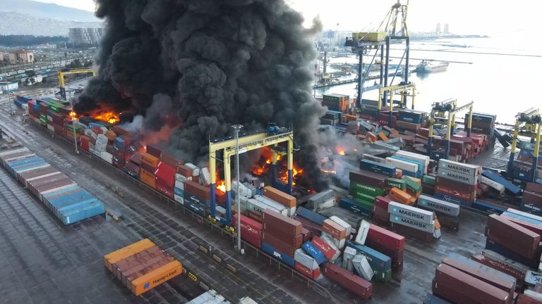 Smoke rises from burning containers at the port in the earthquake-stricken town of Iskenderun, Turkey