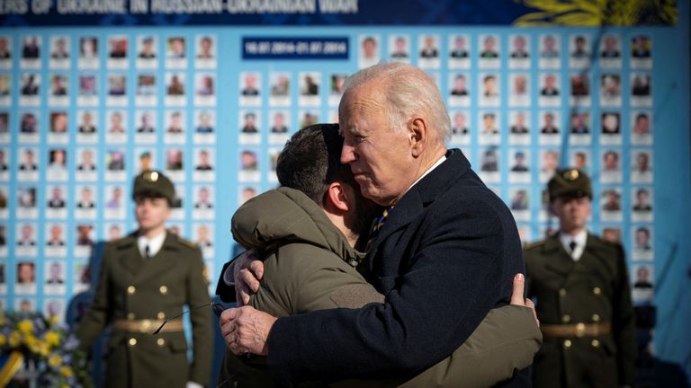 U.S. President Joe Biden embraces Ukraine's President Volodymyr Zelenskyy as they visit the Wall of Remembrance to pay tribute to killed Ukrainian soldiers, amid Russia's attack on Ukraine, in Kyiv, Ukraine February 20, 2023. Ukrainian Presidential Press Service/Handout via REUTERS ATTENTION EDITORS - THIS IMAGE HAS BEEN SUPPLIED BY A THIRD PARTY.
