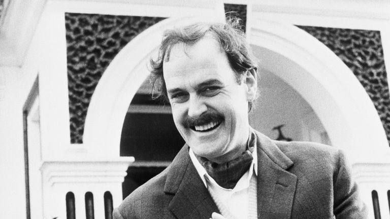 Comedian John Cleese in his role as Basil Fawlty, the manic host of Fawlty Towers.