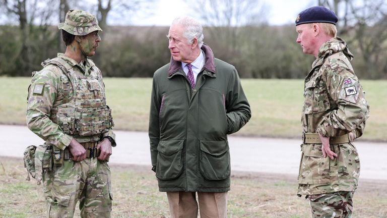 King Charles III  meets Major Tony Harris (left) ahead of a trench attack and defence simulation during a visit to a training site for Ukrainian military recruits, in Wiltshire