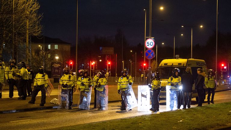 Police in riot gear after a demonstration outside the Suites Hotel in Knowsley, Merseyside