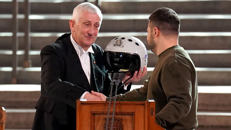 Speaker of the House of Commons, Sir Lindsay Hoyle (left), holds the helmet of one of the most successful Ukrainian pilots, inscribed with the words "We have freedom, give us wings to protect it", which was presented to him by Ukrainian President Volodymyr Zelensky as he addressed parliamentarians in Westminster Hall, London, during his first visit to the UK since the Russian invasion of Ukraine. (Stefan Rousseau/PA)should read: Stefan Rousseau/PA Wire
