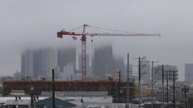 Storm clouds cover skyscrapers in downtown Los Angeles