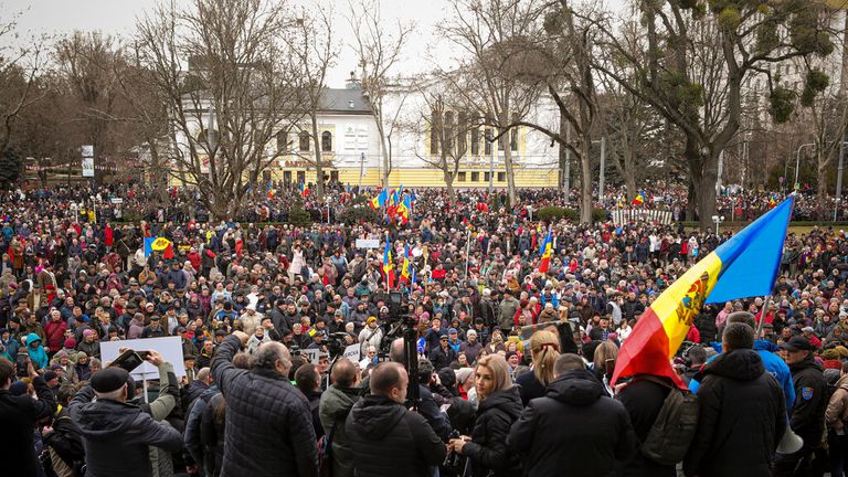 People chant slogans during a protest launched by the newly formed Moldovan People's Movement group and supported by members of the Russia-friendly Shor party against the pro-Western government and low living standards, in Chisinau , Moldova, Sunday, February 19, 2023. (AP Photo/Aurel Obreja)