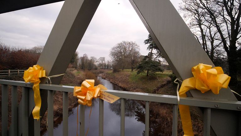 Yellow ribbons have been tied to the bridge over the River Wyre, just downstream from where Nicola Bulley went missing.