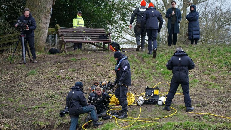 Specialist search teams on the banks of the River Wyre