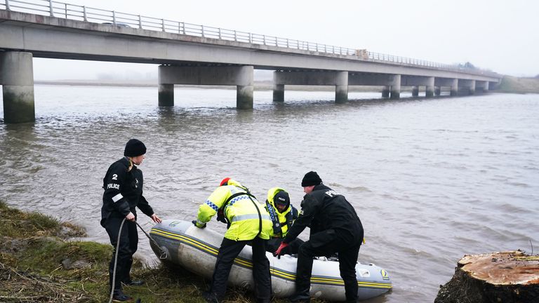 A police Search and Rescue team on the river bank near to Shard Bridge on the River Wyre in Lancashire, as police continue their search for missing woman Nicola Bulley 