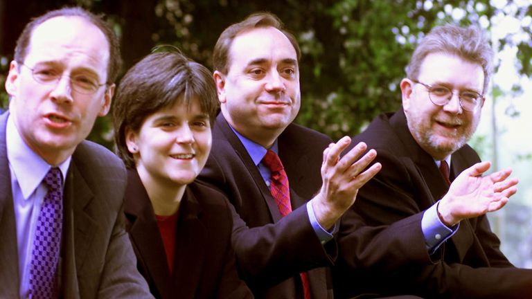 From left: SNP Deputy Convenor John Swinney, Vice Convenor Nicola Sturgeon, Leader Alex Salmond and Chief Executive Mike Russell sit down outside the Holiday Inn hotel in Edinburgh after a press conference held the day after Scottish parliamentary elections.