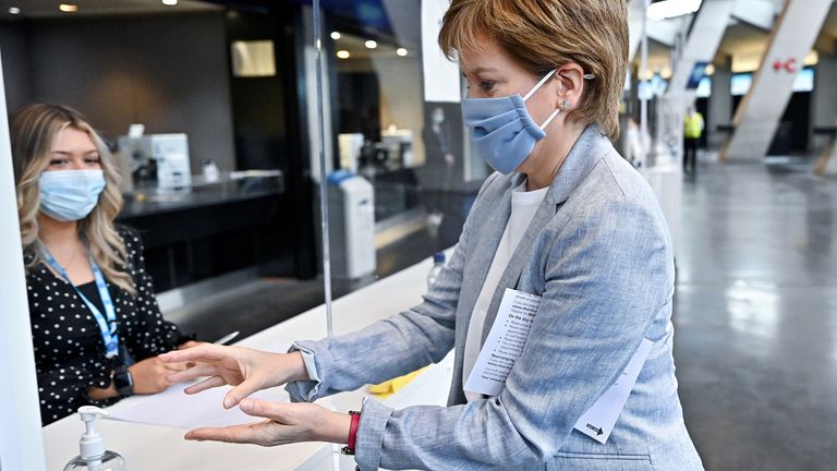 Scottish First Minister Nicola Sturgeon arrives to receive her second dose of the Oxford/AstraZeneca coronavirus disease (COVID-19) vaccine at the NHS Louisa Jordan vaccine centre in Glasgow, Scotland, Britain June 21, 2021. Jeff J Mitchell/Pool vi REUTERS