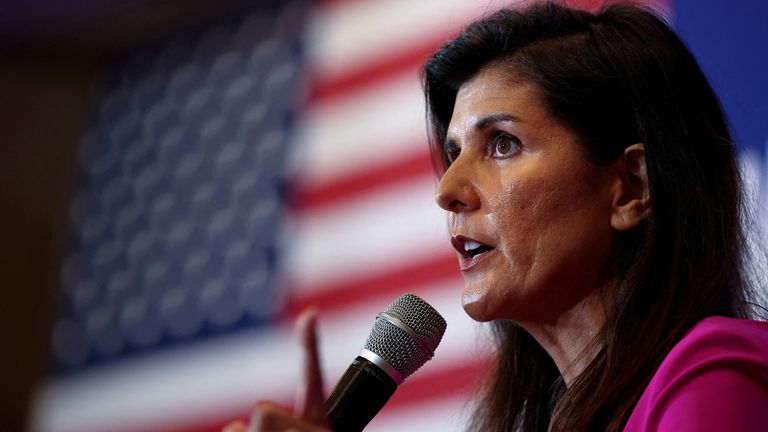 FILE PHOTO: Former South Carolina governor and ambassador to the United Nations Nikki Haley stands for Virginia gubernatorial candidate Glenn Youngkin (R-VA) during a campaign event in McLean, Virginia, U.S., July 14, 2021. ) to help out.REUTERS/Evelyn Hawkstein/File Photo/File Photo