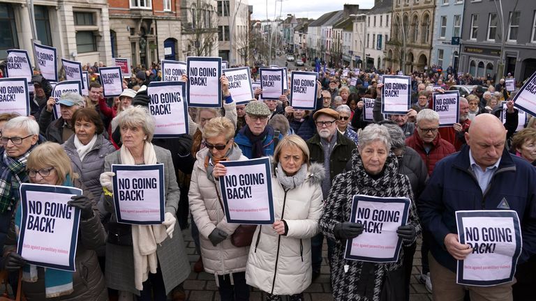 People take part in a rally outside Omagh Courthouse following the shooting of Detective Chief Inspector John Caldwell