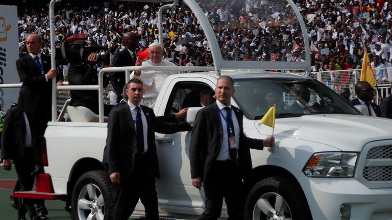 Pope Francis waves from a vehicle before addressing the youth at the Stade des Martyrs, in Kinshasa, Democratic Republic of the Congo