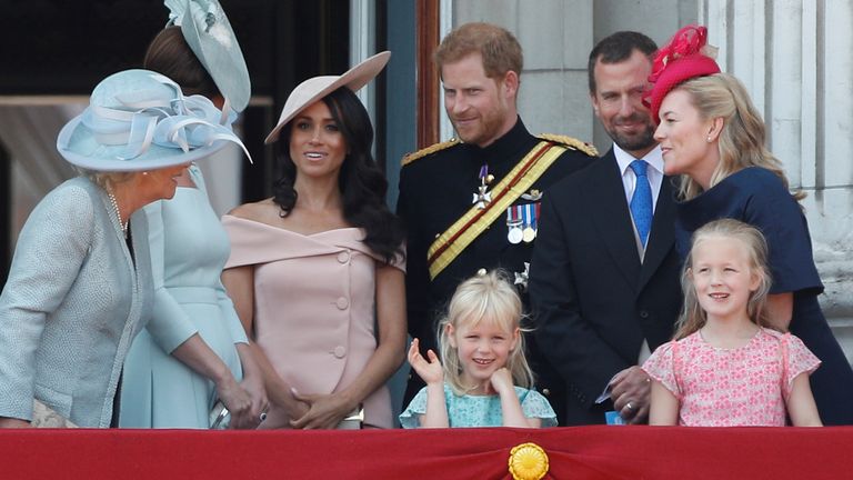 Britain's Prince Harry and Meghan, Duchess of Sussex, along with other members of the British royal family, pose for photographs on the balcony of Buckingham Palace as part of Trooping the Colour parade in central London, Britain, June 9, 2018. REUTERS/Peter Nicholls