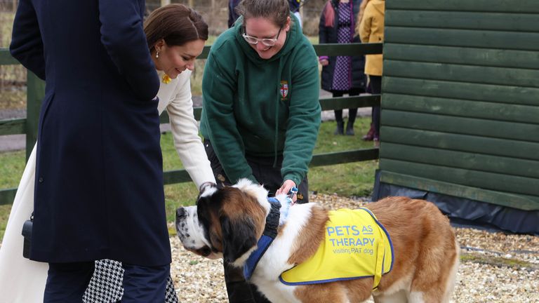 The Princess of Wales pats a dog during a visit to Brynawel Rehabilitation Centre near the town of Pontyclun, Mid Glamorgan, to hear about the work they do to support those struggling with the effects of drug and alcohol addiction. Picture date: Tuesday February 28, 2023.
