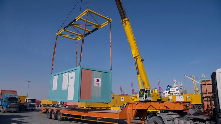 One of a batch of mobile home cabins that Qatar has allocated to be transferred to Turkey as part of relief efforts in the aftermath of a deadly earthquake is transported in Hamad Port, Qatar