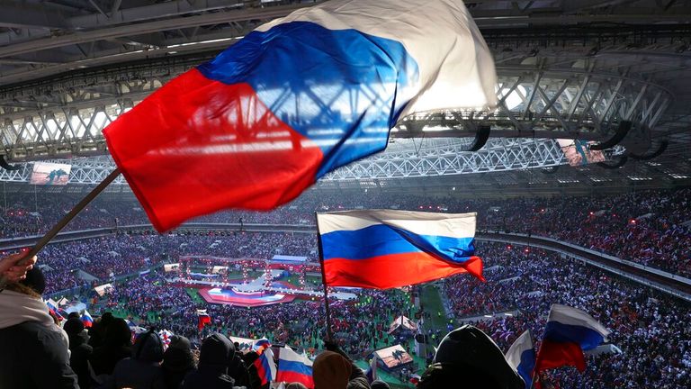 People waving the Russian national flag at the Luzhniki Stadium Pic: AP