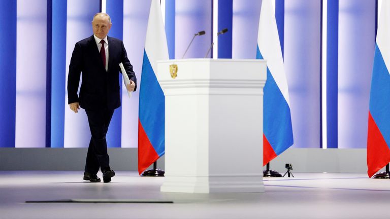 Russian President Vladimir Putin walks to deliver his annual address to the Federal Assembly in Moscow, Russia 