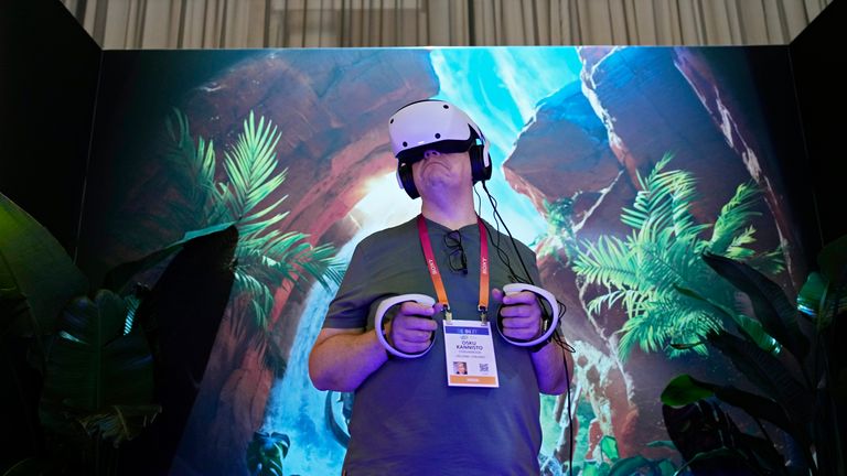 An attendee tries out the Playstation VR2 during Sony's press conference ahead of the CES tech show on Wednesday, Jan. 1.  Las Vegas, April 4, 2023.  (AP Photo/John Locher)