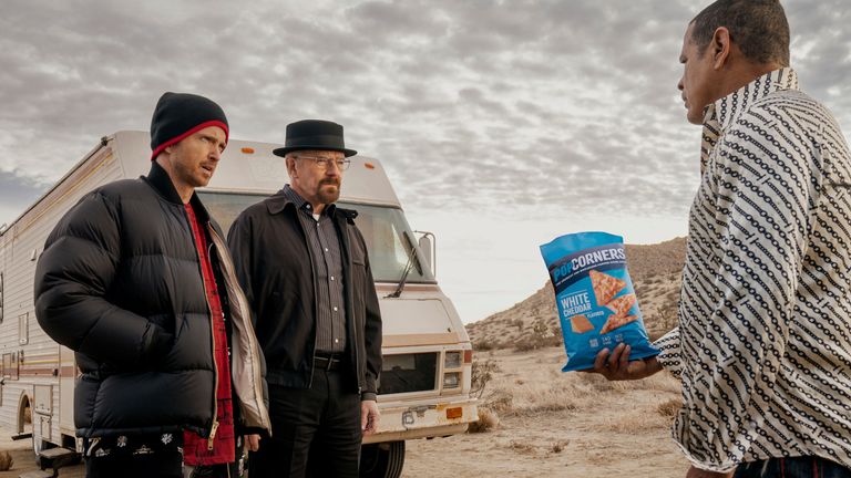 This photo provided by Frito-Lay shows Aaron Paul, Bryan Cranston and Raymond Cruz in scene from PopCorners 2023 Super Bowl NFL football spot.  Big name advertisers are paying as much as $7 million for a 30-second spot during the big game on Sunday, Feb. 12, 2023. In order to get as much as a return on investment for those million, most advertisers release their ads in the days ahead of the big game to get the most publicity for their spots. (Frito-Lay via AP)