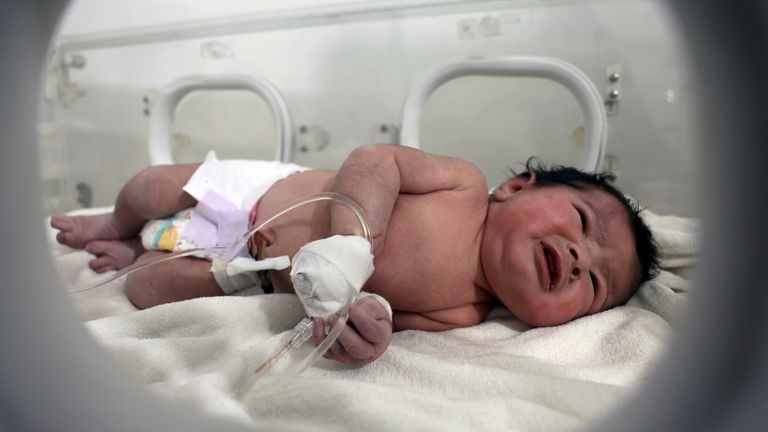 A baby girl who was born under the rubble caused by an earthquake that hit Syria and Turkey receives treatment inside an incubator at a children&#39;s hospital in the town of Afrin, Aleppo province, Syria, Tuesday, Feb. 7, 2023. Residents in the northwest Syrian town discovered the crying infant whose mother gave birth to her while buried underneath the rubble of a five-story apartment building levelled by this week...s devastating earthquake, relatives and a doctor say.  (AP Photo/Ghaith Alsayed)