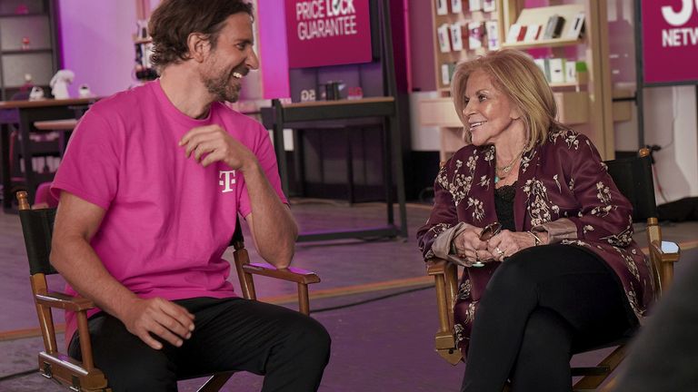 This photo provided by T-Mobile shows Bradley Cooper and his mother Gloria Campano in scene from  T-Mobile 2023 Super Bowl NFL football spot. ( T-Mobile via AP)