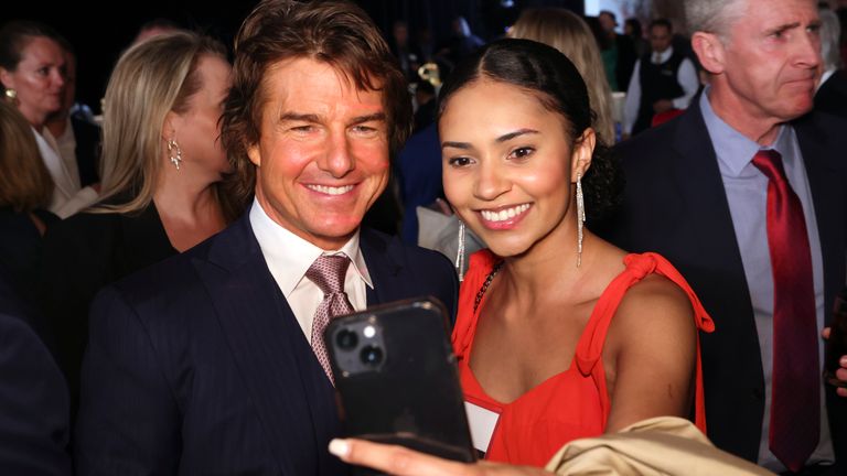 Tom Cruise, left, and Ashli Ferguson attend the 95th Academy Awards Nominees Luncheon on Monday, Feb. 13, 2023, at the Beverly Hilton Hotel in Beverly Hills, Calif. (Photo by Willy Sanjuan/Invision/AP)
