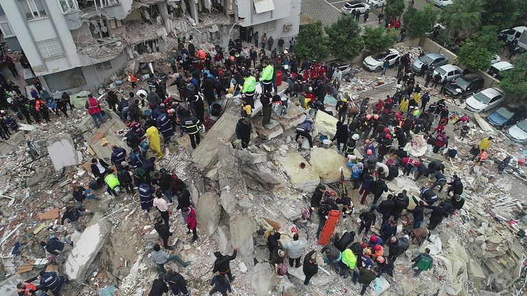 People search through rubble following an earthquake in Adana, Turkey  
Pic: Ihlas News Agency/Reuters