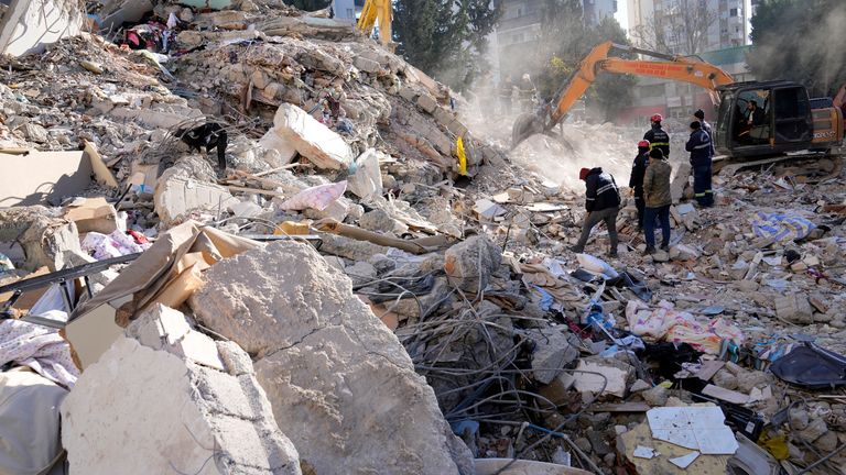 Emergency teams search for people in the rubble of a destroyed building in Adana, southern Turkey
Pic:AP