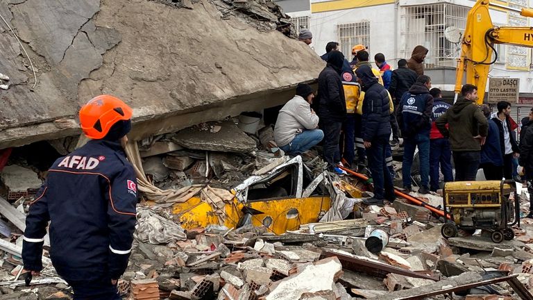 People search through rubble following an earthquake in Diyarbakir, Turkey  