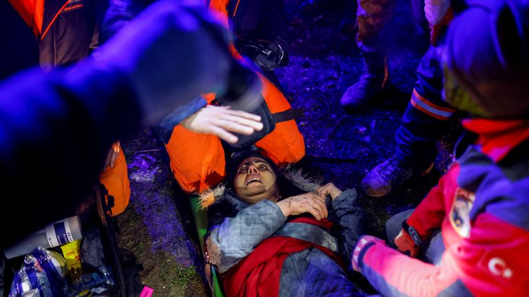 A woman is rescued alive from the rubble following an earthquake in Hatay, Turkey 