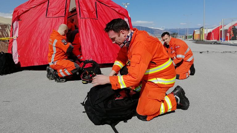 Members of the UK&#39;s International Search & Rescue Team prepare their kit on arrival in Hatay 
Credit:FCDO