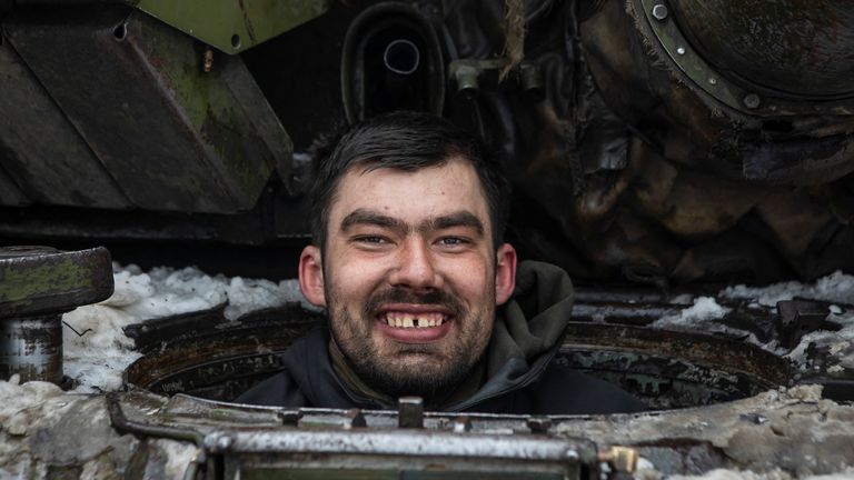 A Ukrainian serviceman smiles as he sits inside a tank outside the frontline town of Bakhmut, amid Russia&#39;s attack on Ukraine, in Donetsk region, Ukraine 