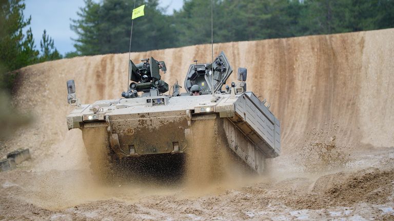 An Ajax Ares tank, an armored personnel carrier, is driven on the training range, during a visit by Defence Secretary Ben Wallace, who is viewing Ukrainian soldiers training on Challenger 2 tanks, at Bovington Camp, a British Army military base in Dorset, Britain, February 22, 2023. Ben Birchall/Pool via REUTERS