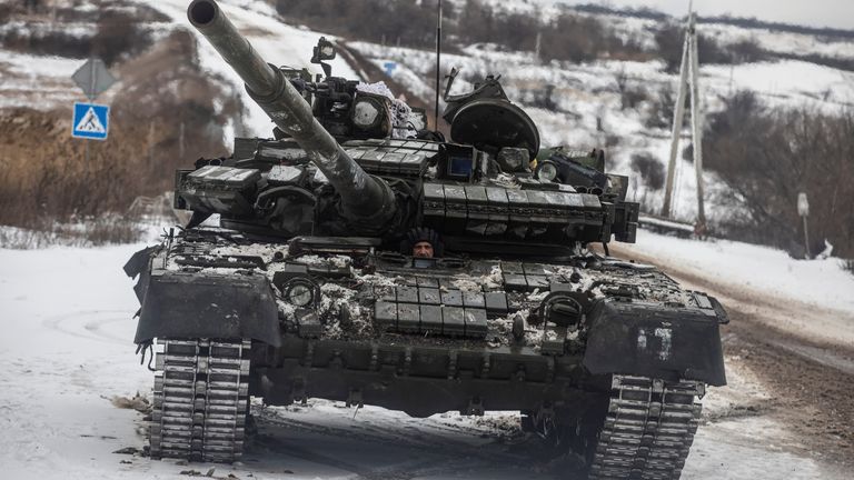 A Ukrainian serviceman drives a tank along a road outside the frontline town of Bakhmut, amid Russia&#39;s attack on Ukraine, in Donetsk region, Ukraine February 14, 2023. REUTERS/Yevhenii Zavhorodnii
