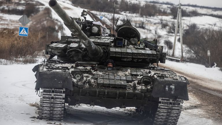 A Ukrainian serviceman drives a tank along a road outside the frontline town of Bakhmut, amid Russia&#39;s attack on Ukraine, in Donetsk region, Ukraine February 14, 2023. REUTERS/Yevhenii Zavhorodnii
