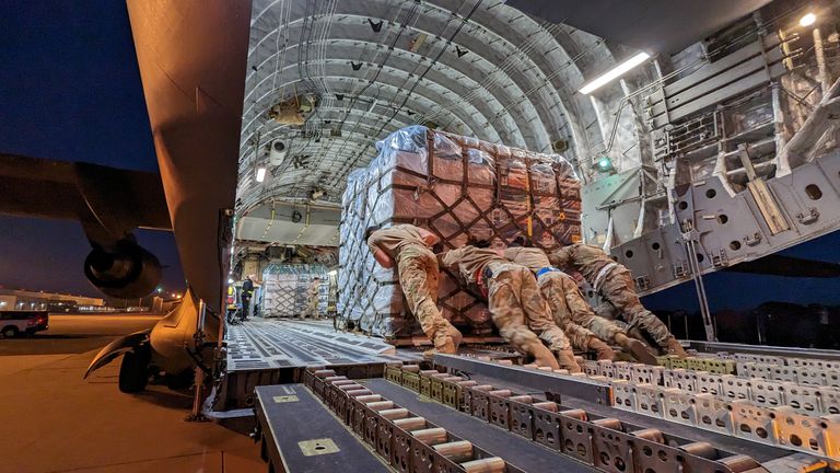 Equipment and supplies to help in support operations for victims of the earthquake in Turkey are loaded onto a transport plane at Dover Air Force Base, Delaware.