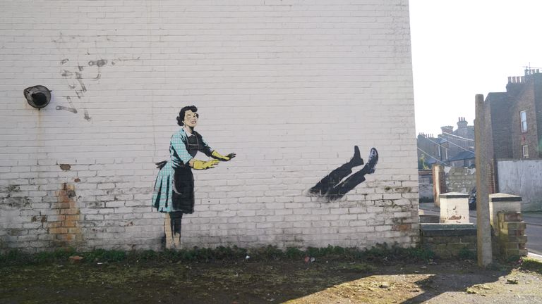 The new artwork by street artist Banksy, titled &#39;Valentine&#39;s Day Mascara&#39; on the side of a building in Margate, Kent, which has had a chest freezer and items of broken furniture that were part of the installation removed