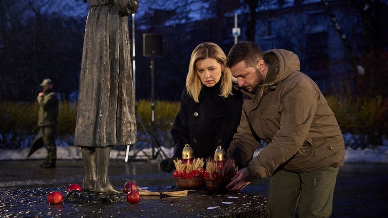 Ukraine&#39;s President Volodymyr Zelenskiy and his wife Olena place candles and ears of wheat to a monument to Holodomor victims during a commemoration ceremony of the famine of 1932-33, in which millions died of hunger, amid Russia&#39;s attack on Ukraine, in Kyiv, Ukraine November 26, 2022. Ukrainian Presidential Press Service/Handout via REUTERS ATTENTION EDITORS - THIS IMAGE HAS BEEN SUPPLIED BY A THIRD PARTY.
