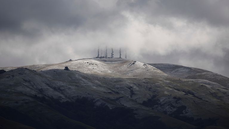 The East Bay Hills around Mission Peak are dusted with snow Thursday, Feb. 23, 2023, in Fremont, Calif. (Dai Sugano/Bay Area News Group via AP)


