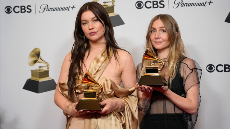 Rhian Teasdale, left, and Hester Chambers of Wet Leg pose in the press room with the awards for best alternative music performance for "Chaise Lounge" and best alternative music album for "Wet Leg" at the 65th annual Grammy Awards on Sunday, Feb. 5, 2023, in Los Angeles. (AP Photo/Jae C. Hong)