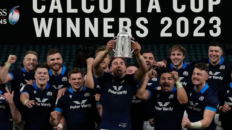 Scotland players celebrate with the Calcutta cup after defeating England 29-23 during the Six Nations rugby union international match at Twickenham in London, England, Saturday, Feb. 4, 2023. (AP Photo/Alastair Grant)