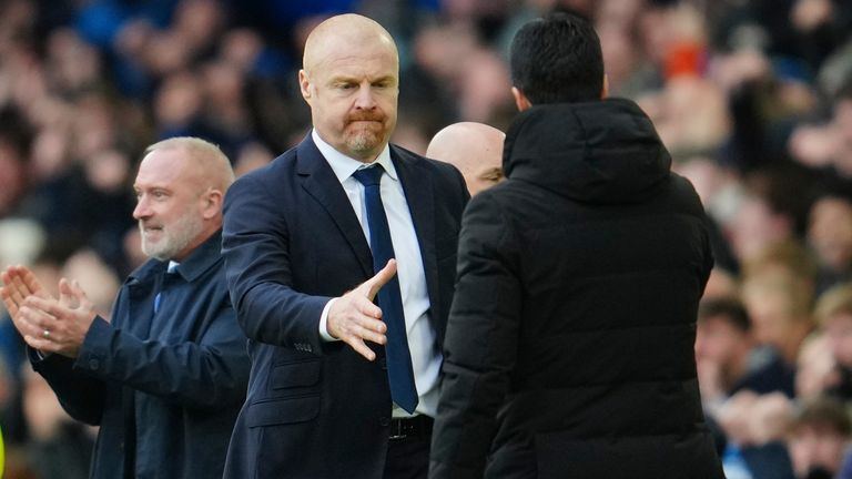 Everton&#39;s head coach Sean Dyche, centre, greets Arsenal&#39;s manager Mikel Arteta after the English Premier League soccer match between Everton and Arsenal at Goodison Park in Liverpool, England, Saturday, Feb. 4, 2023. (AP Photo/Jon Super)