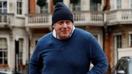 Former British Prime Minister Boris Johnson walks home after his morning run, in London, Britain March 21, 2023. REUTERS/Peter Nicholls