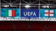 11 July 2021, United Kingdom, London: Football: European Championship, Italy - England, final round, final at Wembley Stadium. The UEFA logo hangs between the flags of Italy and England. Photo by: Christian Charisius/picture-alliance/dpa/AP Images