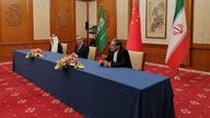 In this photo released by Nournews, Secretary of Iran&#39;s Supreme National Security Council, Ali Shamkhani, right, China&#39;s most senior diplomat Wang Yi, center, and Saudi Arabia&#39;s National Security Adviser Musaad bin Mohammed al-Aiban looks on during an agreement signing ceremony between Iran and Saudi Arabia to reestablish diplomatic relations and reopen embassies after seven years of tensions between the Mideast rivals, in Beijing, China, Friday, March 10, 2023. (Nournews via AP)