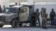 Israeli soldiers are deployed at the site of an exchange of gunfire near a military post in the West Bank. Pic: AP