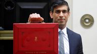 Britain's Chancellor Rishi Sunak stands with his red briefcase in front of 11 Downing Street in London, Wednesday, March 3, 2021. Pic: AP
