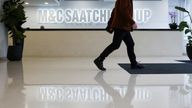 A person walks through the reception of the M&C Saatchi office in central London, Britain, January 6, 2022. REUTERS/Henry Nicholls